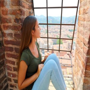 Woman Enjoying Bologna's Cityscape